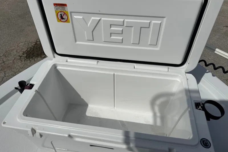 Slide: The Image of Open YETI cooler on a 2012 Shallow Sport 21 Modified V boat deck. - 28