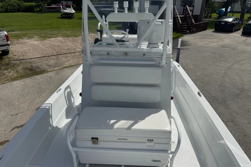 Slide: The Image of 2012 Shallow Sport 21 Modified V boat interior with seating and steering console. - 30