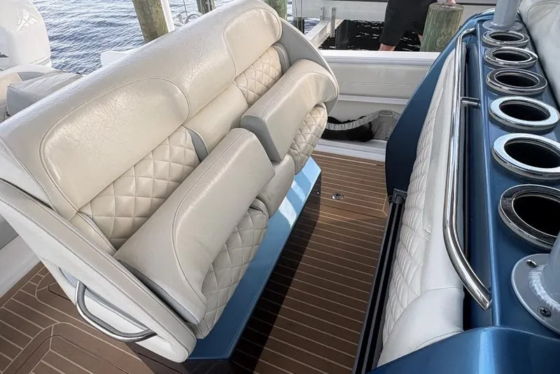 Slide: The Image of Luxurious seating on a 2014 Nor-Tech 390 Sport boat with elegant upholstery and cup holders. - 9