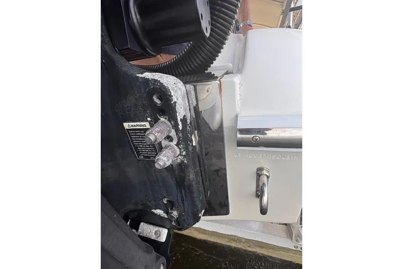 Slide: The Image of Close-up of a 2014 Nor-Tech 390 Sport boat's engine mount and warning label. - 17