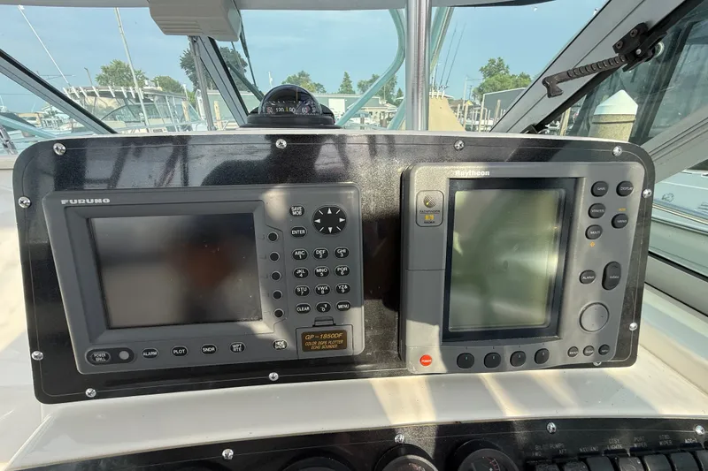 Slide: The Image of Control panel of a 2000 Boston Whaler 28 Conquest with navigation equipment. - 12