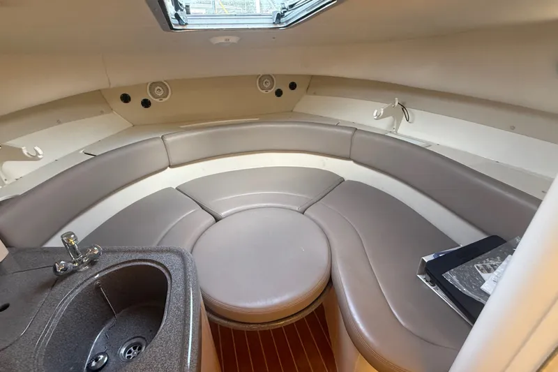 Slide: The Image of Interior of 2000 Boston Whaler 28 Conquest with seating and compact sink. - 14