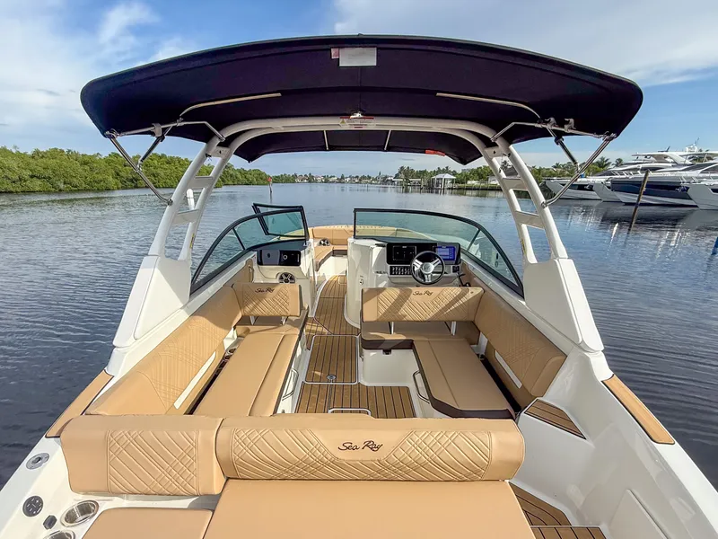 Slide: The Image of The image shows a 2027 Sea Ray SDX 270 Outboard boat with elegant seating and a modern cockpit. - 5
