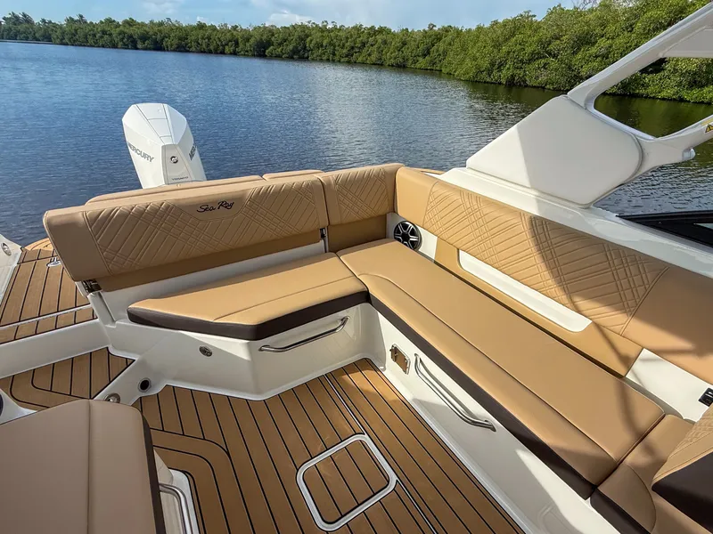 Slide: The Image of The image shows the cockpit of a 2027 Sea Ray SDX 270 Outboard with elegant seating. - 9