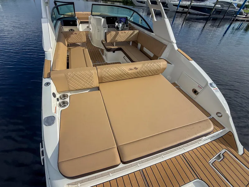 Slide: The Image of The image shows a Sea Ray SDX 270 Outboard boat with sleek beige upholstery. - 7