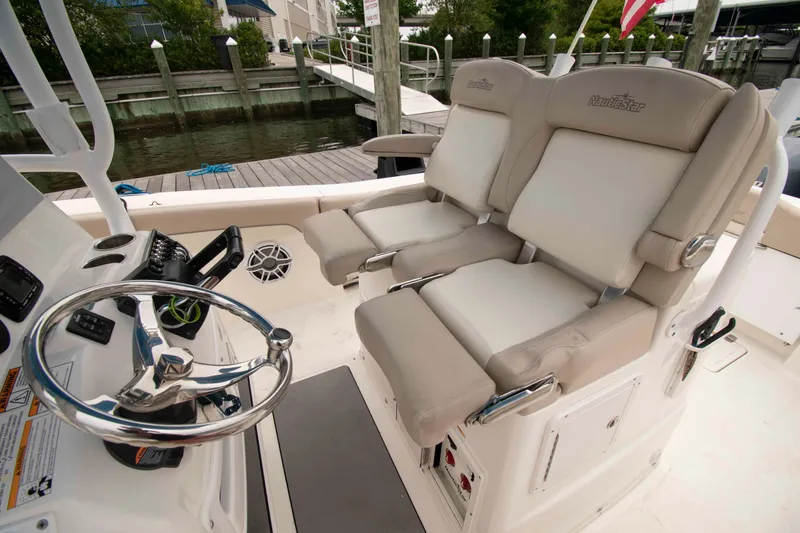 Slide: The Image of 2016 NauticStar 28 XS boat interior with dual helm seats and steering wheel. - 5