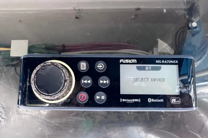 Slide: The Image of Fusion MS-RA70NSX stereo system in 2001 Cobia 254 Center Console boat, displaying "Select Device." - 31