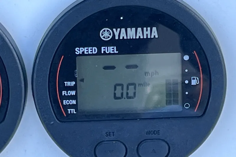 Slide: The Image of Yamaha speed fuel gauge on 2001 Cobia 254 Center Console boat, displaying 0.0 mph. - 28