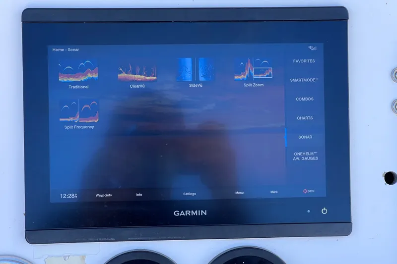 Slide: The Image of Garmin sonar display on 2001 Cobia 254 Center Console boat dashboard. - 25