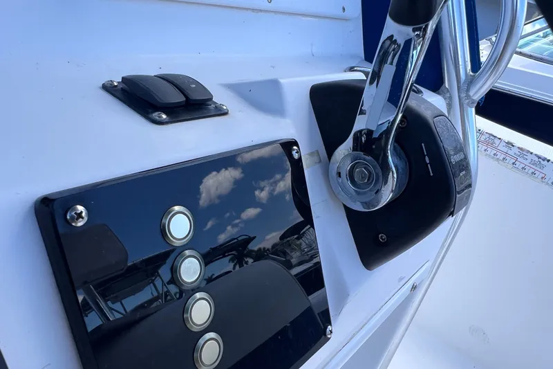 Slide: The Image of Close-up of 2001 Cobia 254 Center Console boat controls and throttle. - 29