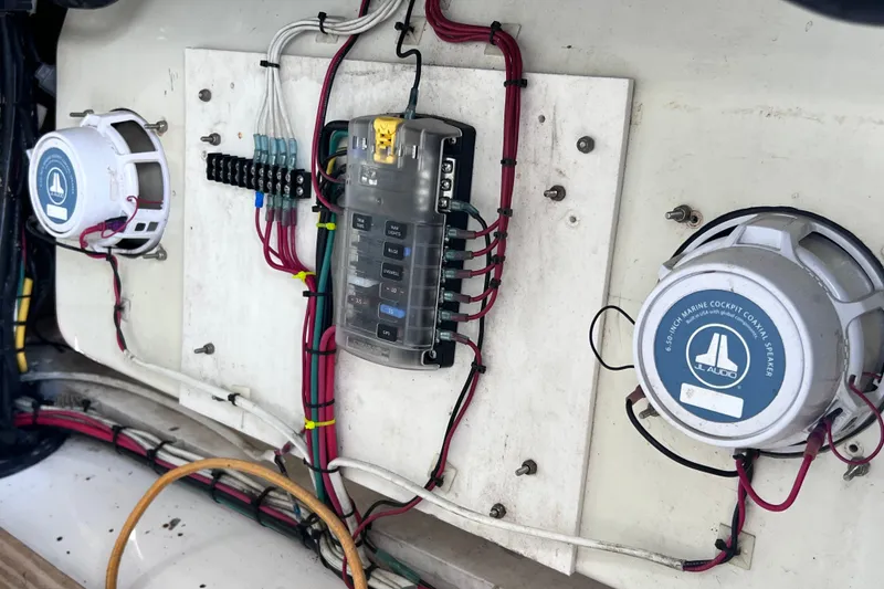 Slide: The Image of Electrical panel and speakers on a 2001 Cobia 254 Center Console boat. - 44