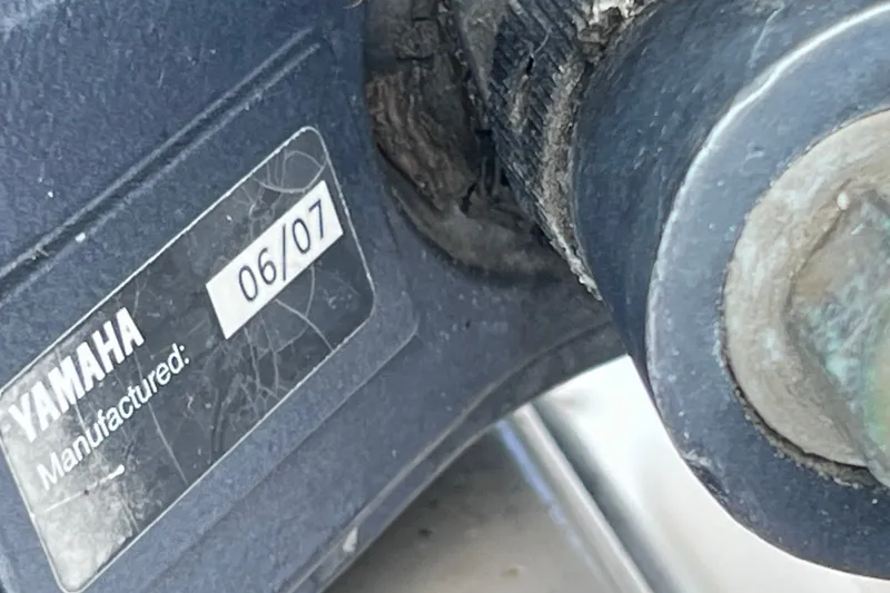 Slide: The Image of Close-up of a Yamaha engine part with manufacturing date 06/07 on a 2001 Cobia 254 Center Console. - 45