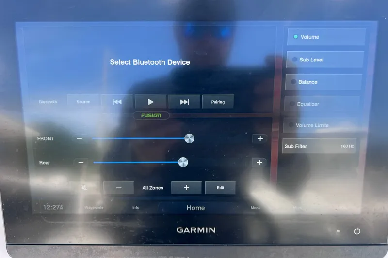 Slide: The Image of Garmin display showing Bluetooth audio settings on a 2001 Cobia 254 Center Console boat. - 23