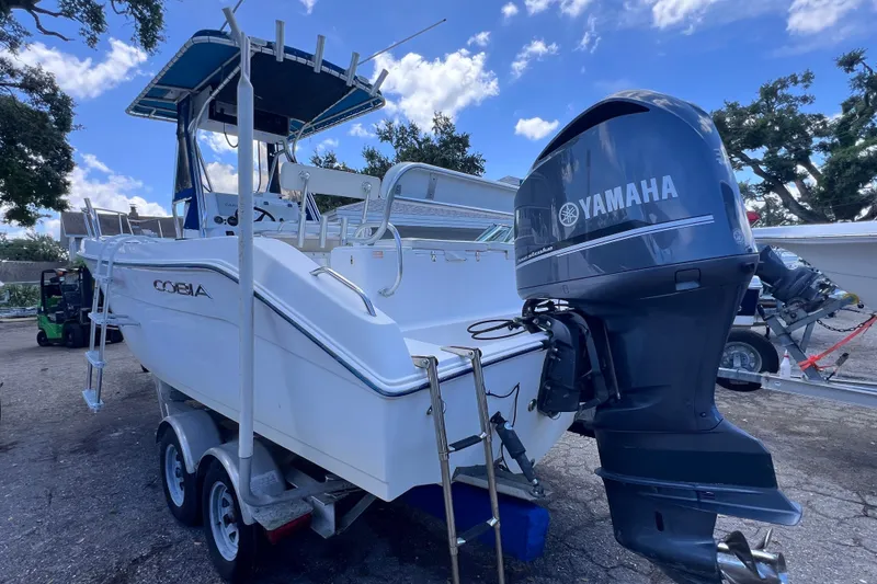 Slide: The Image of 2001 Cobia 254 Center Console boat with Yamaha outboard motor on trailer. - 3