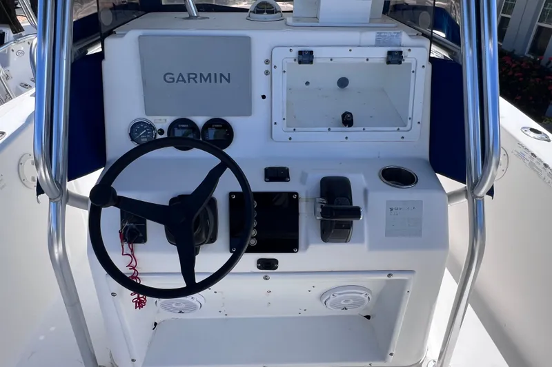 Slide: The Image of Center console of 2001 Cobia 254 boat with Garmin navigation system. - 20