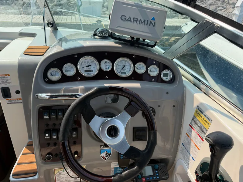 Slide: The Image of The image shows the cockpit of a 2004 Chaparral Signature 240 boat with a Garmin navigation system. - 9
