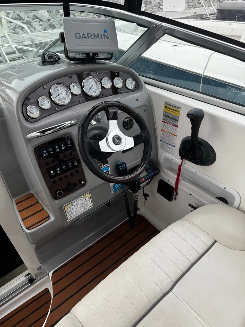 Slide: The Image of The image shows the cockpit of a 2004 Chaparral Signature 240 with a Garmin navigation system. - 5