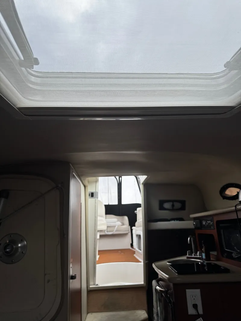 Slide: The Image of Interior view of a 2004 Chaparral Signature 240 with kitchenette and skylights. - 9