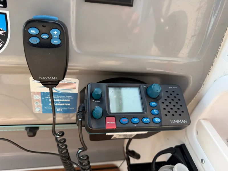 Slide: The Image of A Navman VHF 7200 radio is mounted on a boat's control panel. - 16