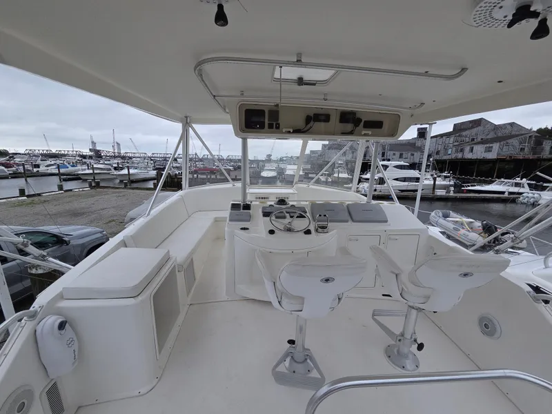 Slide: The Image of The image shows the helm of a 2002 Ocean Convertible with two seats and a steering wheel. - 31