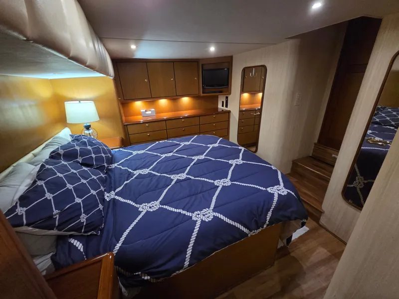 Slide: The Image of The image shows a cozy cabin with a large bed, wooden furniture, and soft lighting. - 8