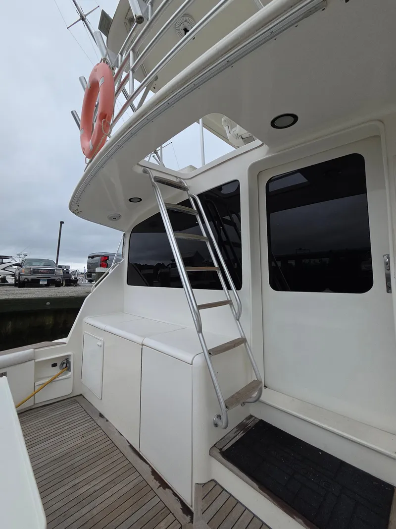 Slide: The Image of The 2002 Ocean Convertible features an exterior staircase and a spacious platform with wood details. - 28