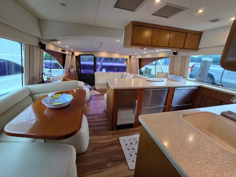 Slide: The Image of Interior of a 2002 Ocean Convertible with a sleek kitchen and cozy dining area. - 5