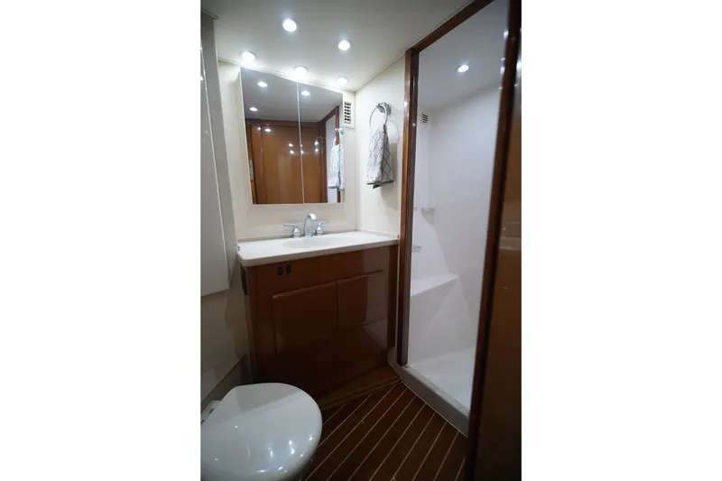 Slide: The Image of Luxurious bathroom in a 2005 Post 50 Convertible yacht, featuring modern fixtures and elegant design. - 21