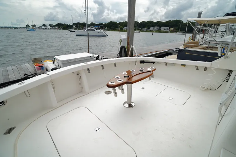 Slide: The Image of Spacious deck of a 2005 Post 50 Convertible yacht docked at a marina. - 14