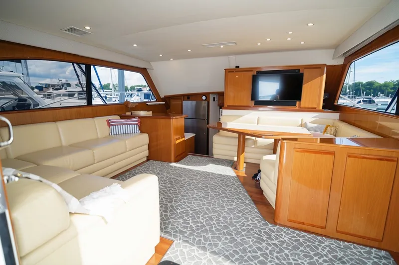 Slide: The Image of Luxurious interior of a 2005 Post 50 Convertible yacht with plush seating and modern amenities. - 15