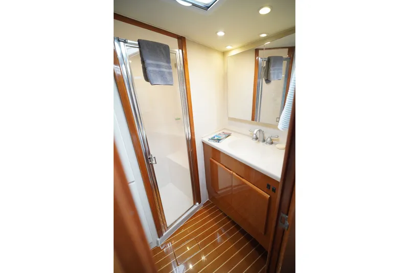 Slide: The Image of Luxurious bathroom in a 2005 Post 50 Convertible yacht, featuring a shower and vanity. - 20