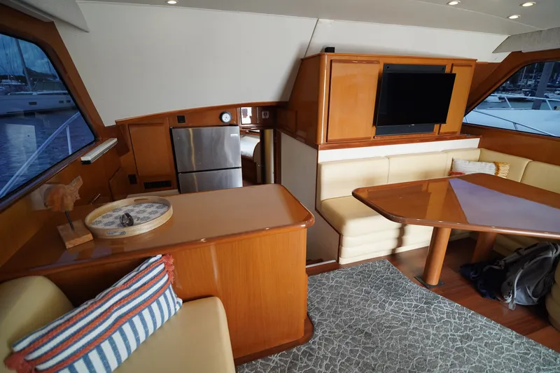 Slide: The Image of Luxurious 2005 Post 50 Convertible yacht interior with dining area and modern amenities. - 16