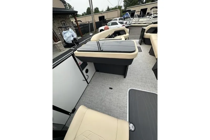 Slide: The Image of Luxurious interior of 2026 Flamingo Rove 24' boat with beige seating and sleek design. - 27