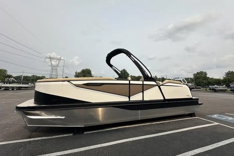 Slide: The Image of 2026 Flamingo Rove 24' pontoon boat parked in a lot, side view. - 7