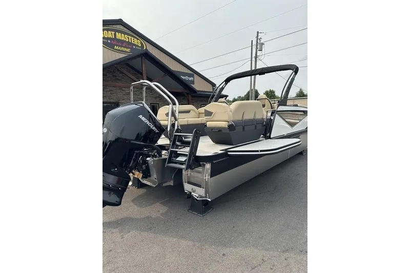 Slide: The Image of 2026 Flamingo Rove 24' pontoon boat with Mercury outboard motor at dealership. - 12