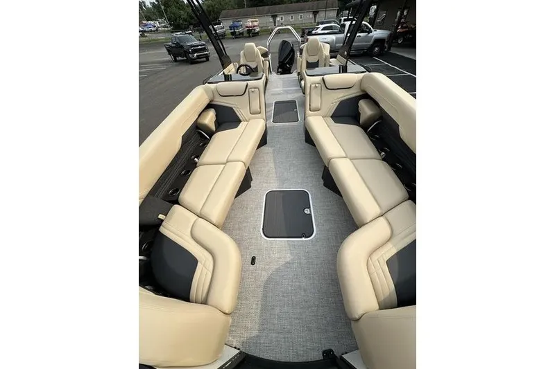 Slide: The Image of Luxurious interior of 2026 Flamingo Rove 24' boat with beige seating and modern design. - 11