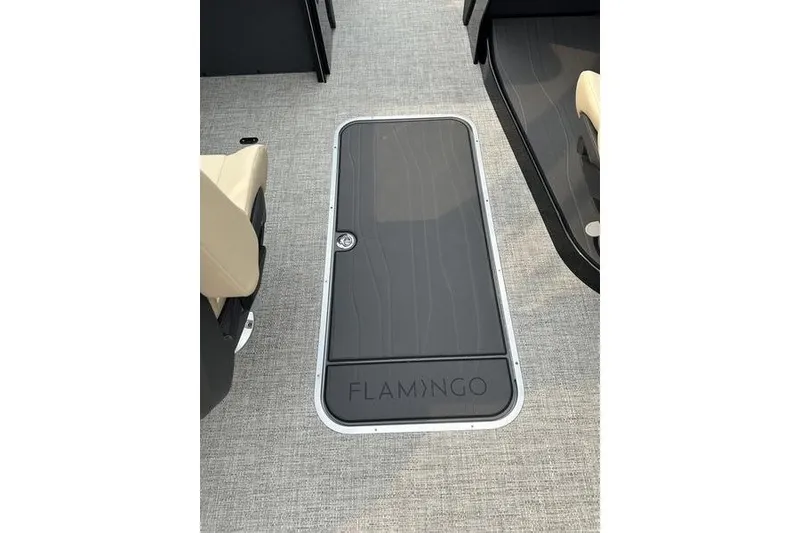 Slide: The Image of 2026 Flamingo Rove 24' boat interior with sleek hatch design and beige seating. - 30