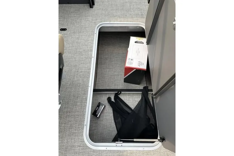 Slide: The Image of Storage compartment in 2026 Flamingo Rove 24' RV with box and netting. - 33