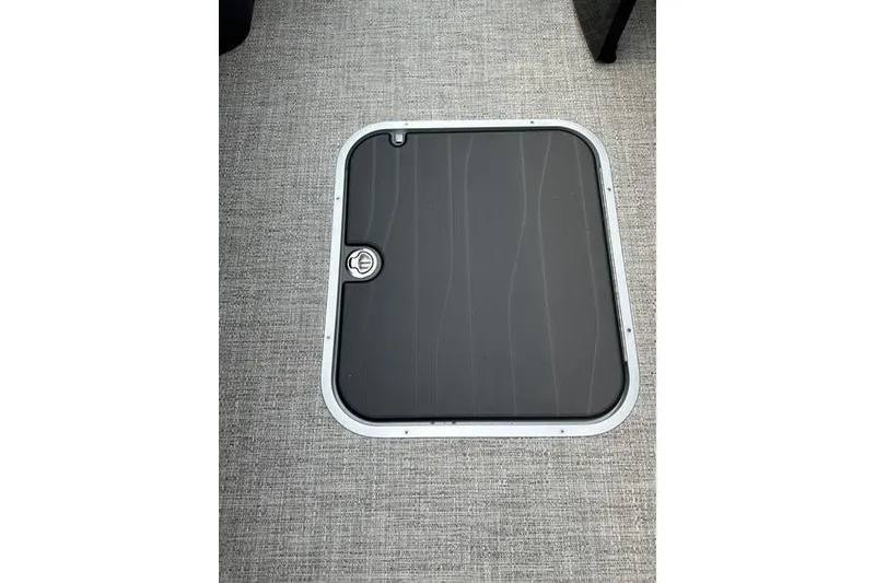 Slide: The Image of Hatch door on Flamingo Rove 24', 2026 model, with textured gray flooring. - 21