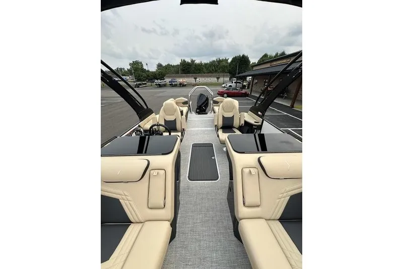 Slide: The Image of Luxurious interior of 2026 Flamingo Rove 24' boat with beige seating and sleek design. - 18