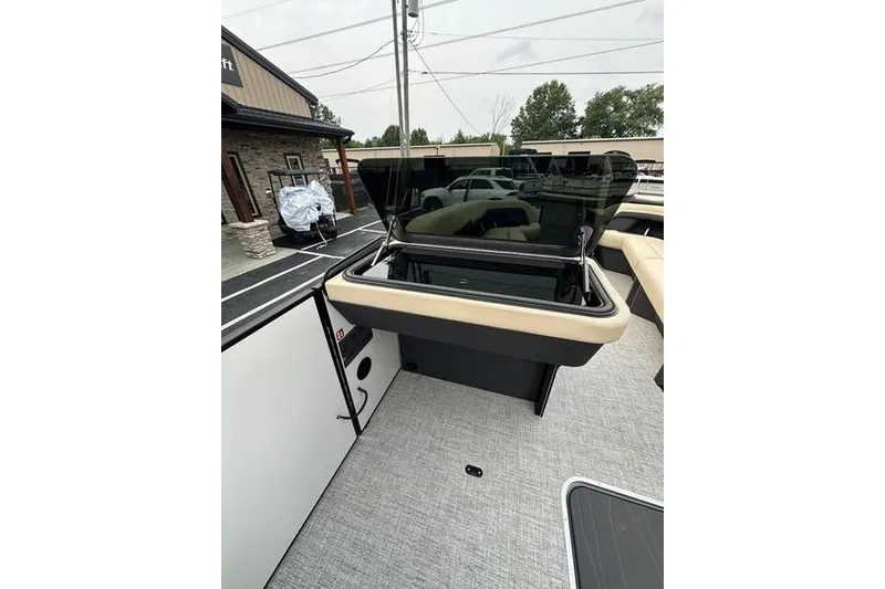 Slide: The Image of 2026 Flamingo Rove 24' boat interior with open windshield and modern design. - 38