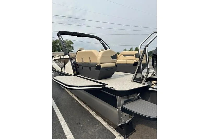 Slide: The Image of 2026 Flamingo Rove 24' pontoon boat with beige seating and sleek design. - 10