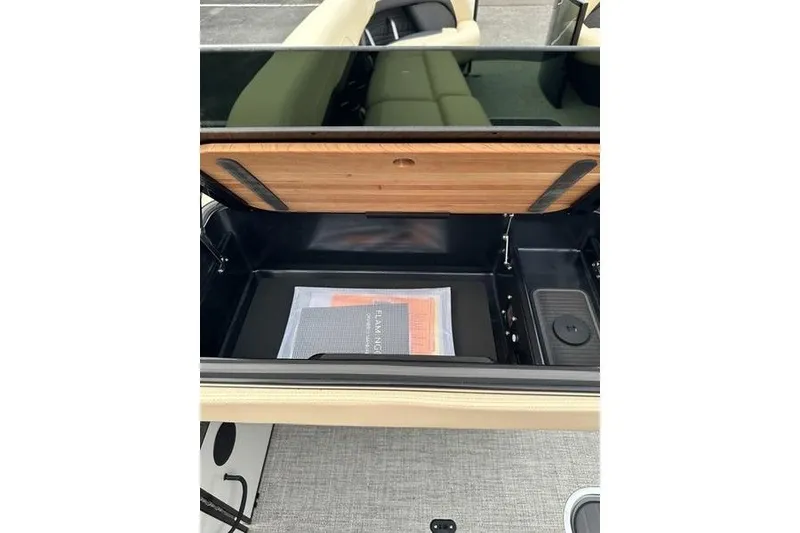 Slide: The Image of Open storage compartment in a 2026 Flamingo Rove 24' vehicle interior. - 28