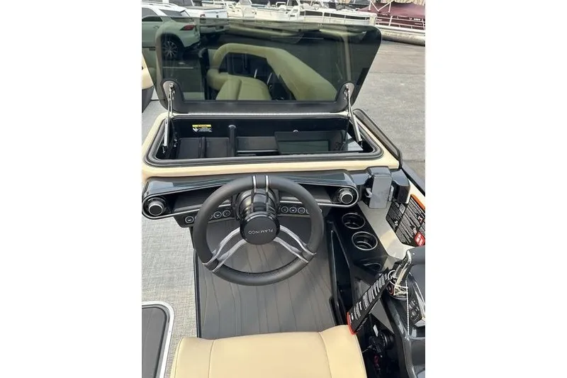 Slide: The Image of Interior view of 2026 Flamingo Rove 24' boat cockpit with steering wheel and controls. - 25