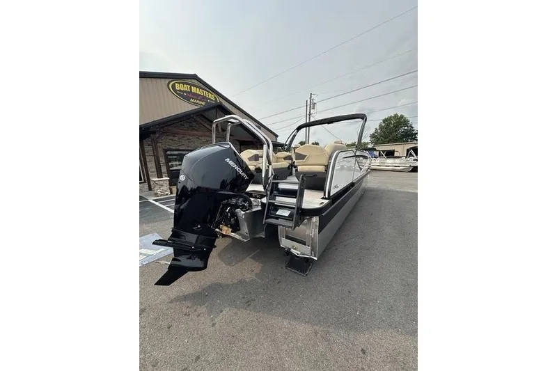 Slide: The Image of 2026 Flamingo Rove 24' boat with Mercury outboard motor at dealership. - 9