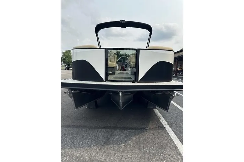 Slide: The Image of 2026 Flamingo Rove 24' pontoon boat, rear view in parking lot. - 2