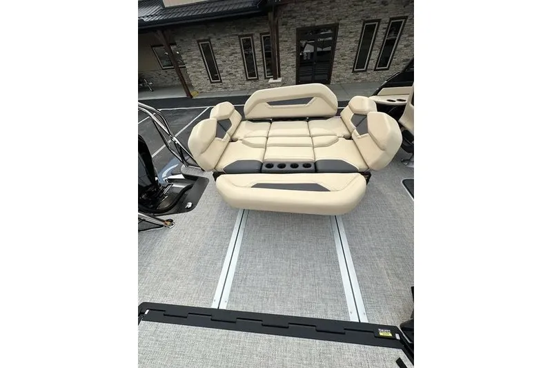 Slide: The Image of Luxurious seating on 2026 Flamingo Rove 24' boat, featuring beige and gray upholstery. - 26