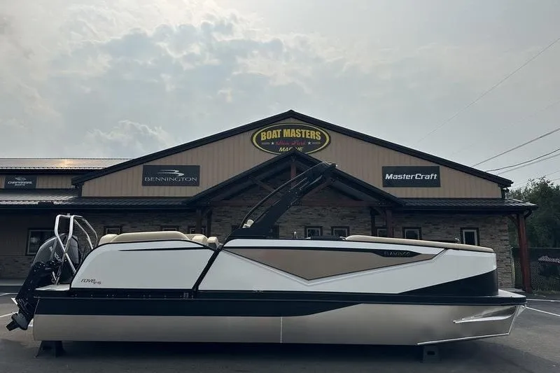 Slide: The Image of 2026 Flamingo Rove 24' boat displayed outside Boat Masters Marine dealership. - 1