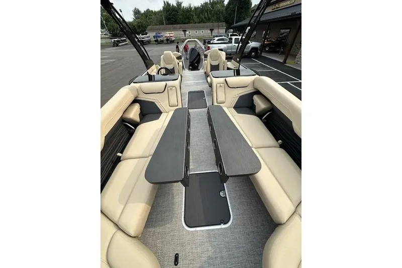 Slide: The Image of Luxurious interior of 2026 Flamingo Rove 24' boat with beige seating and sleek tables. - 19