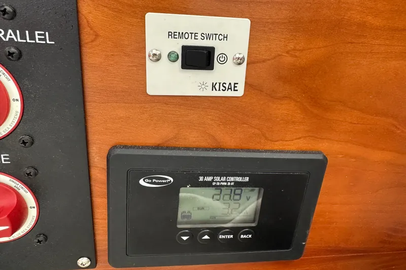 Slide: The Image of Control panel with Kisae remote switch and Go Power solar controller on Cutwater C-242 Coupe, 2017. - 17